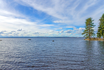 Vast body of water on Lake Onega in Karelia against a blue sky.
