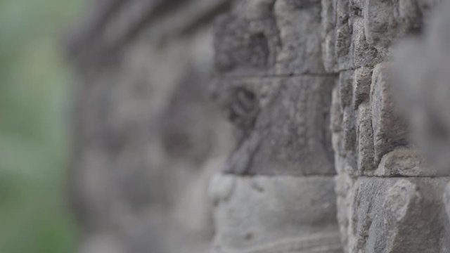 temples in Indonesia with sculptural closeup of images on the walls of the temple