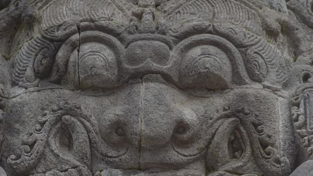 temples in Indonesia with sculptural closeup of images on the walls of the temple