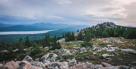 View from rocky mountain of Zyuratkul' National Park on the valley with coniferous forest and lake 