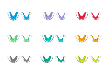 Retainer teeth, Braces,Many colors  Red color, Blue color,Yellow color,  Green color Retainer(top viwe) on a white background