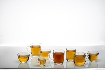 glass cups with hot tea on table, close view    