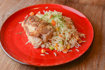 Grilled salmon steak with seasoned rice and vegetables. Restaurant food.