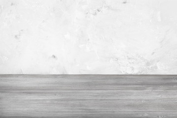 gray wooden floor and gray concrete wall (focus on wooden planks near wall on background)