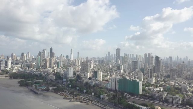 An aerial view of tall skyscrapers in South Mumbai in the early hours of the day with lots of clouds present
