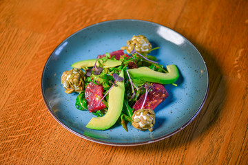 Avocado salad with lemon and fresh sunflower seeds and sprouts. Lenten meal. Fresh organic vegetables.