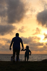 Old Dutch Fort, Galle, Sri Lanka - 06112018: Photograph of a son and father enjoying the sun set good for fathers day celebration