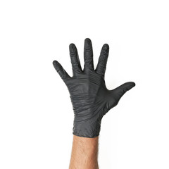 Męska dłoń w jednorazowej czarnej rękawiczce