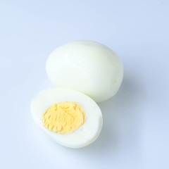halves of boiled eggs on white background. the view from the top
