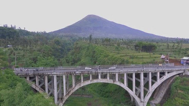 the construction of the beautiful Sigandul bridge in temanggung in central java is in front of a beautiful mountain