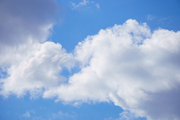 Fototapeta na wymiar White clouds on blue sky background, close up