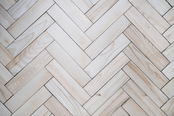 Fototapeta premium Light beige parquet floor as a background