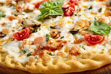 Seafood pizza on wooden board