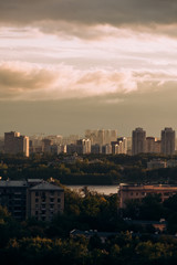 Moscow. Top view. Stormy sky with clouds and orange gaps. Big city. Industrial. View of ordinary houses in Moscow, a big city