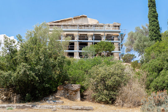 View of the main facade of the Temple of Hephaestus with scaffolding during the rehabilitation works in the Ancient Agora, Athens, Greece