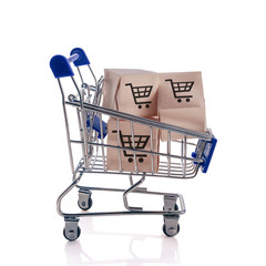 Shopping cart with boxes isolated on white background. The concept of an online shopping, and delivery