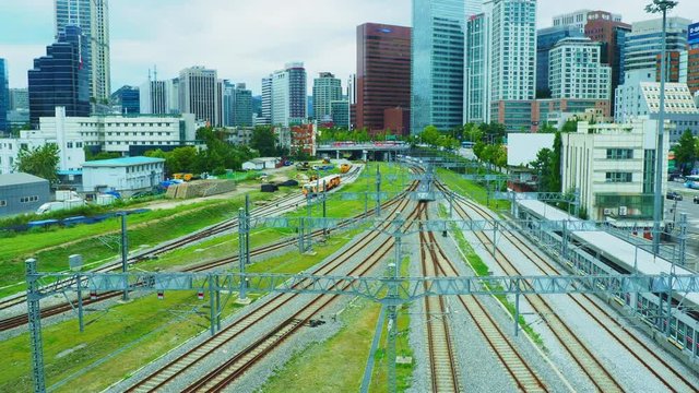 Train coming to Seoul Station with cityscape background in Seoul, South Korea