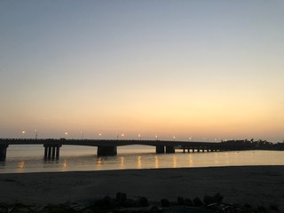 Naklejka na ściany i meble Sunset with bridge