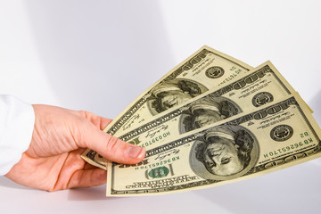 dollar currency, hand holding dollars cash on the black background