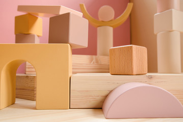 A town made of elements of a wooden children's designer of pastel colors.