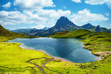 View of the Pic du Midi d'Ossau with lake in the French Pyrenees - obrazy, fototapety, plakaty