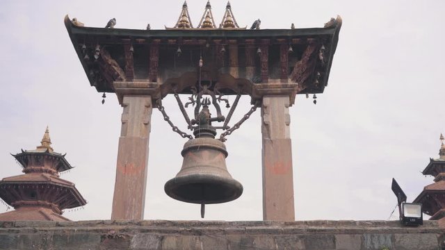The Old Taleju Bell In Patan Durbar Square, Kathmandu Valley, Nepal Under The Dramatic Sky - Panning Shot