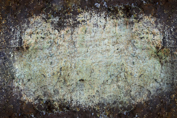 Grunge wall texture background. Paint cracking off dark wall with rust underneath. Copy Space.