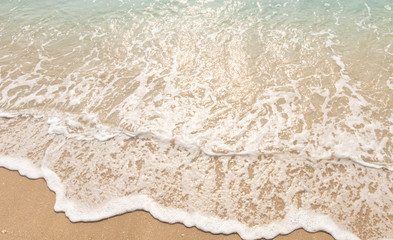 wave of blue ocean on sandy beach. texture Background.