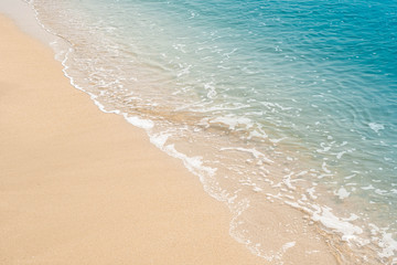 wave of blue ocean on sandy beach. texture Background.