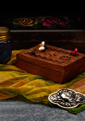 Space for peace and relaxation. Silk handkerchief, jewelry and vintage boxes