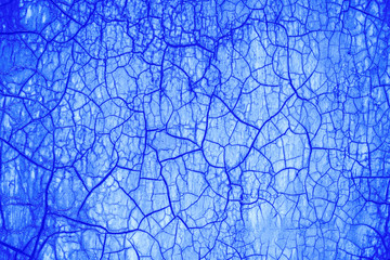 Obraz premium Cracked surface, abstract blue background