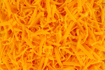 Grated cheddar cheese background texture