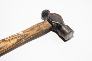 Old hammer with wooden handle on white background