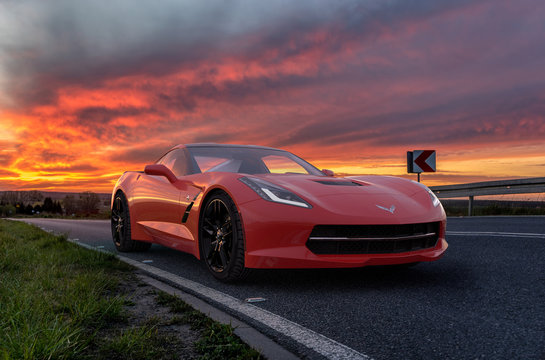 Chevrolet Corvette C7 on the road during a dramatic sunset