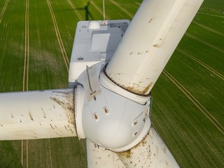 
Wind turbine inspection of the rotors and the turbine close up detail shot with a drone - oil...