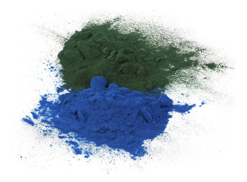 Green and blue spirulina powder isolated on white background