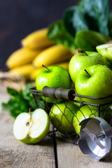 group of healthy green apples, spinach, bananas and mint are ingredients for a smoothie. Detox, diet, healthy, vegetarian food concept