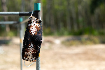 Cloth mask made from batik, washed and hung in the sun.