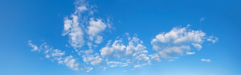 Naklejka na ściany i meble Beautiful blue sky panorama with white clouds. Banner.