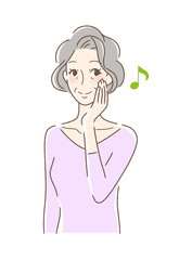 笑顔で頬を触る女性