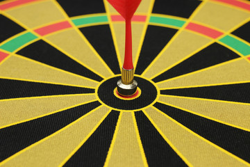 Red sticks to bullseye on a dart board