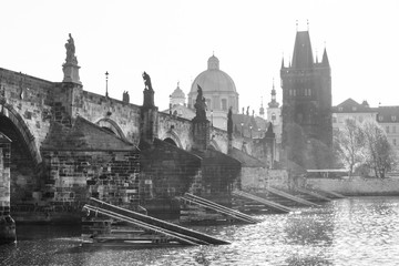 Morning on Charles Bridge, Czech: Karluv most. Hazy sunrise daybreak. Praha, Czech Republic