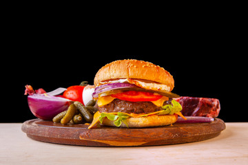 fresh hamburger with cheese meat greens and tomato