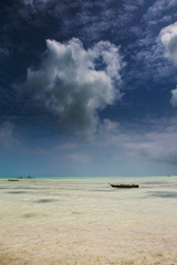 Fototapeta na wymiar Wooden Fishing Boat at Tropical Beach in Zanzibar Island ,Tanzania