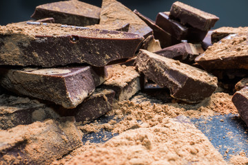 Chopped chocolate with cocoa, big pieces. Dessert, sugar, carbohydrates and fats concept.