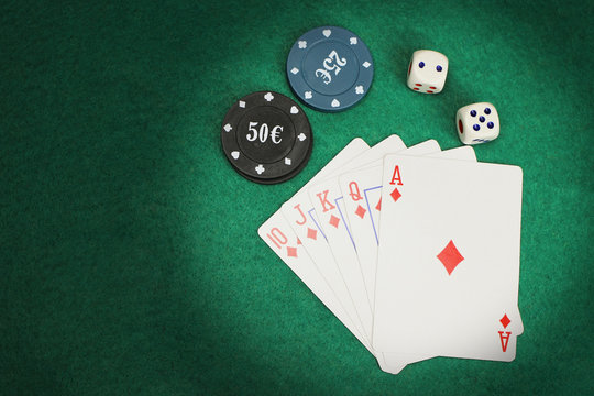 casino elements-dice, chips, cards-a combination of Royal flush on a green felt table - Powered by Adobe