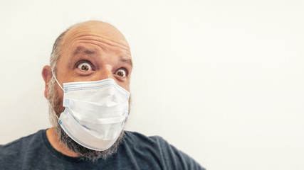 astonished bald man with a mask