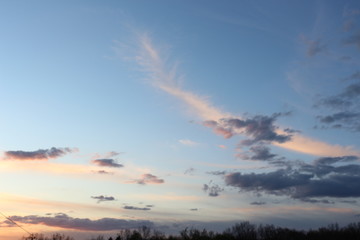 The clouds are beautiful in the rays of the setting sun.