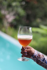Cold Beer in Wine Glass On Hand Holder. 
