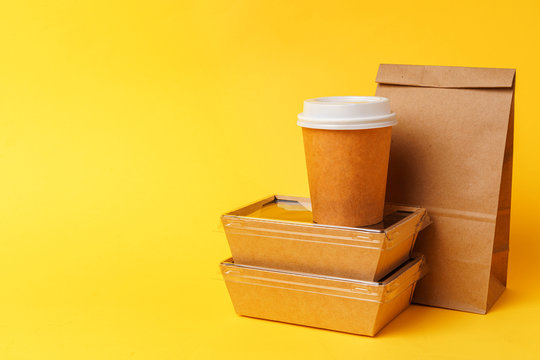 Takeaway Food Concept. Some Packed Food In Container With Coffee Cup On Table